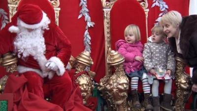 Two children in santa's grotto in York