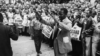 ANC supporters pray in front of the courthouse of Johannesburg, 28 December 1956, to support 152 anti-apartheid militants during their trial.