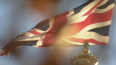 Union Jack flag flying in wind