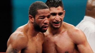 Peterson and Khan pose after their fight