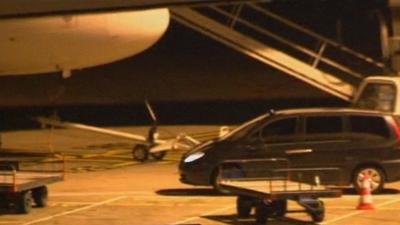 Noriega arrives in a car at Orly airport in Paris