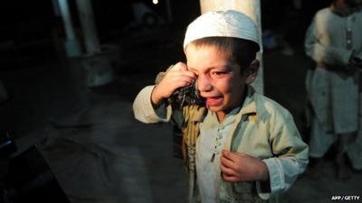 A young student cries after being rescued