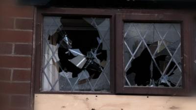 Windows of house smashed inwards