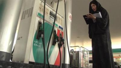 Girl at petrol pump