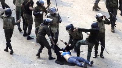 Police and woman protester