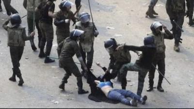 Woman being beaten by Egyptian troops