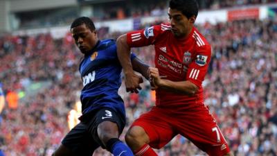 Patrice Evra and Luis Suarez