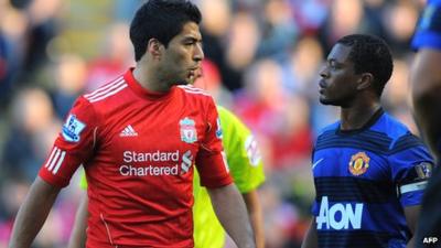 Liverpool's Luis Suarez and Manchester United's Patrice Evra exchange words during the Premier League match at Anfield.