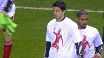 Luis Suarez and his Liverpool team-mates wear T-shirts of support