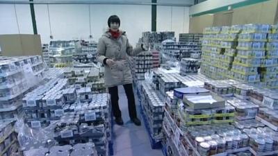 Fiona Trott in a warehouse full of donated food