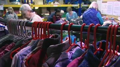 Rack of clothes in charity shop