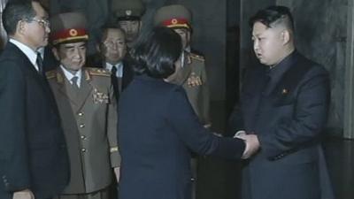 Kim Jong-un, right, late North Korean leader Kim Jong-il's youngest known son and successor, shakes hands with Hyundai Group Chairwoman Hyun Jeong-eun