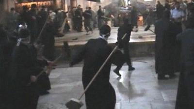 Brooms being thrown in the fight
