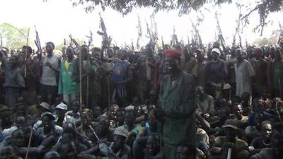 Armed Lou Nuer men listen to South Sudan's Vice-President Riek Machar - 28 December 2011.