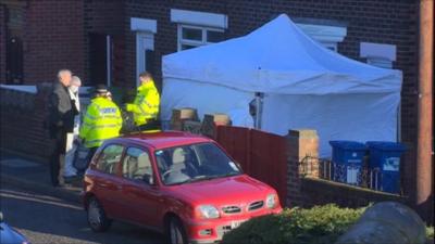 Forensics team outside house