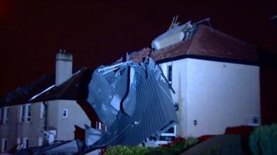 Night shot of wrecked house