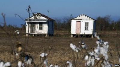 Two sharecropper shacks in a field near Belzoni turned into museum pieces