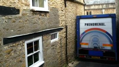 Lorry stuck in narrow road