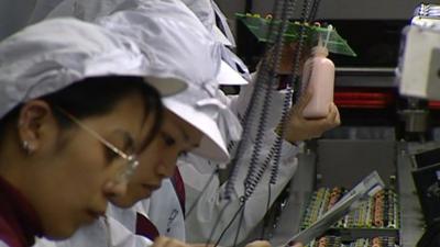 Workers in Taiwanese electronics factory