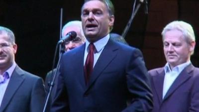 Hungarian Prime Minister, Viktor Orban speaks at a microphone.