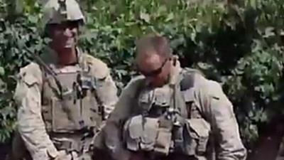 Still from video allegedly showing US Marines urinating on Afghan corpses