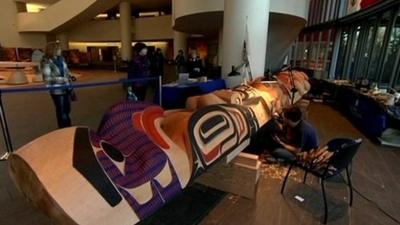 A totem pole being carved