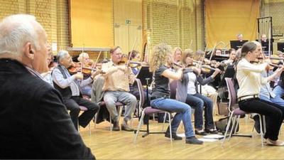 Sir Anthony Hopkins watches the City of Birmingham Symphony Orchestra rehearse before a performance of his work in Birmingham last July