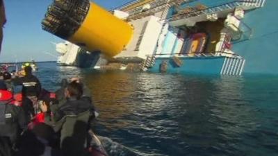 Coastguard boat near sunk cruise ship