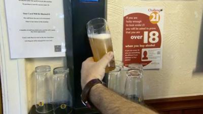 A pint being poured using the beer dispenser