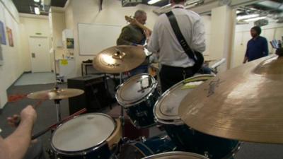 Musicians playing in the prison