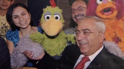 Characters from Sesame Street with Palestinian Authority Prime Minister Salam Fayyad