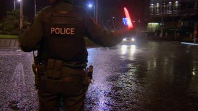 Police officer directs traffic in Derry