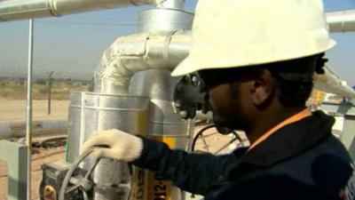 Man working at an oil processing plant