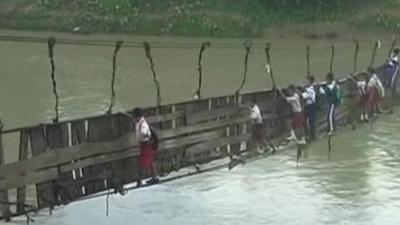 Children crossing the bridge