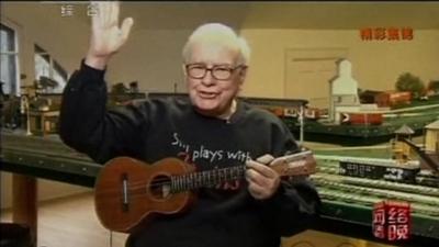 Warren Buffett with a guitar