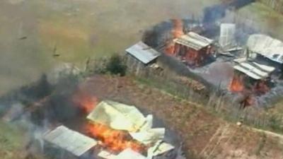 Homes on fire in Kenya in 2007