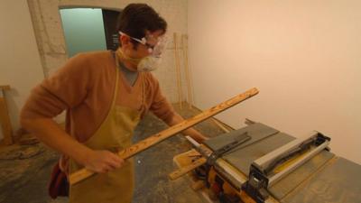 Man working with lumber