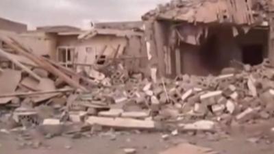 Damaged buildings in Zinjibar