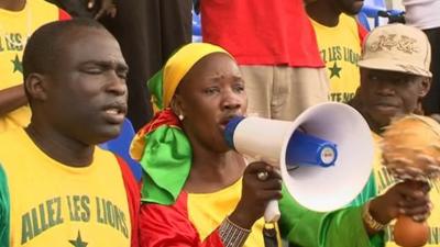 Senegal fans are cheering for their team