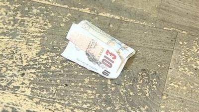 Ten pound note dropped on the floor