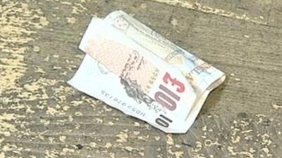 Ten pound note dropped on the floor