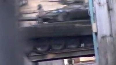 Unverified image of a tank moving towards the centre of Damascus.