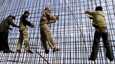 Workers at a construction site in Ahmedabad, India