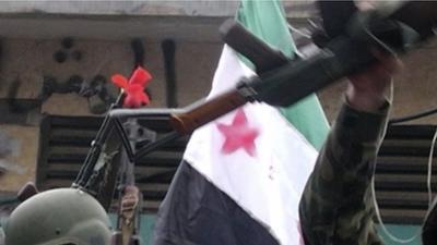 Rifle and and Syrian flag