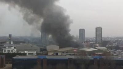 Smoke coming out of what is thought to be a dairy in west London