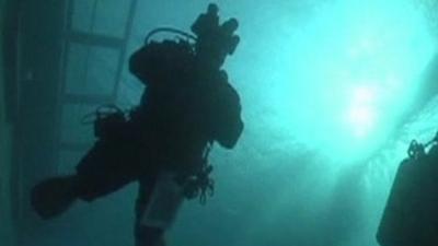 Diver in waters around Costa Concordia