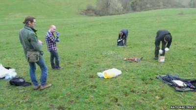 Investigators taking samples from a deer