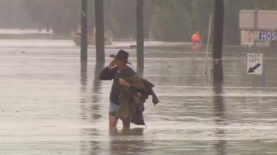 Man standing in floodwater