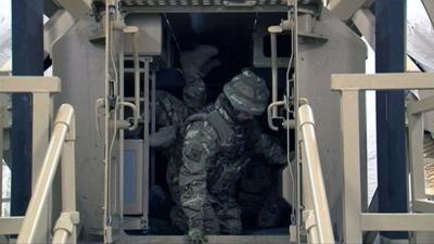 British soldiers use a simulator in training