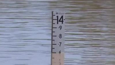 A ruler measuring the floodwater